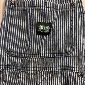 Boys overalls . size 6 conductor white and blue striped denim overalls .